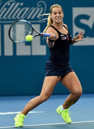Dominika Cibulkova of Slovakia hits a return against Yanina Wickmayer of Belgium in their first round women's singles match at the Brisbane International tennis tournament on January 3, 2016. AFP PHOTO / Saeed KHAN -- IMAGE RESTRICTED TO EDITORIAL USE - STRICTLY NO COMMERCIAL USE / AFP / SAEED KHAN (Photo credit should read SAEED KHAN/AFP/Getty Images)